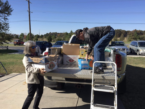Stephanie Manos and James Floyd unload a food rescue pickup. SUBMITTED PHOTOS