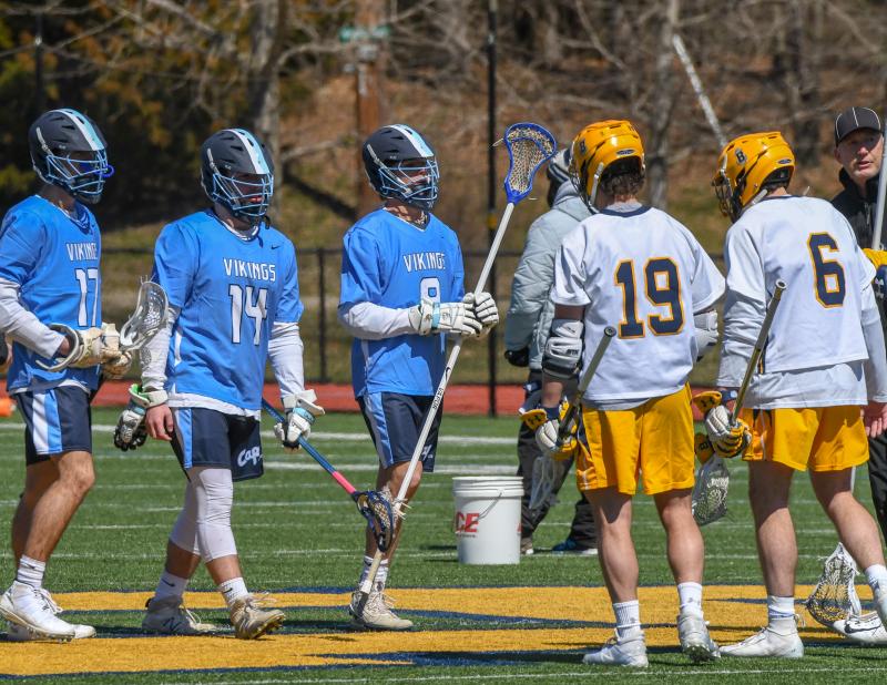 Cape captains (l-r) Luke D’Ambrogi, Billy Ott and Matt Prestipino meet at midfield with Robert Schain and Matt Kelly of the Bullis School. DAVE FREDERICK PHOTO