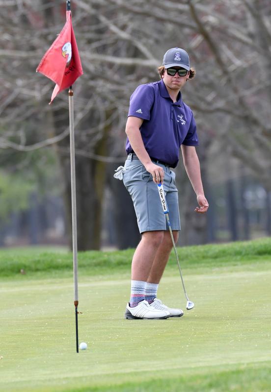 Sussex Academy sophomore Adison Browne watches his ball into the cup. He shot a 46.