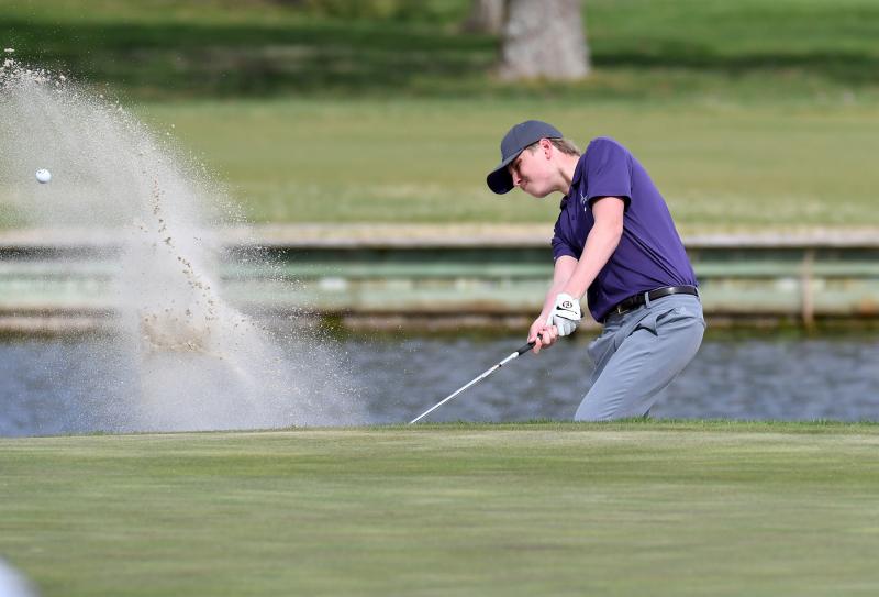 Sussex Academy’s Caden Schell smashes out of a trap. He shot a 45 in the match.