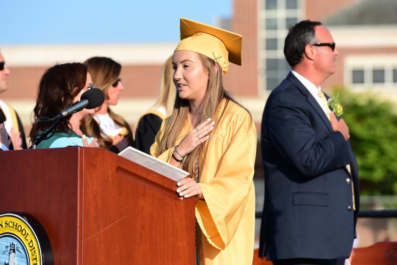Cape Class of 2019 Secretary Hannah Lewis leads the salute to the flag.