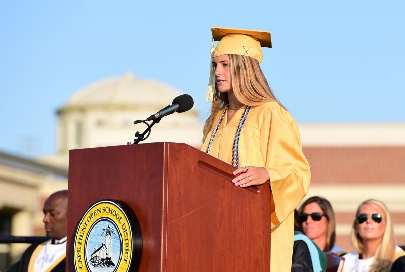 Class Treasurer Alia Marshall presents the senior gift, a picnic table located in the Cape High courtyard.
