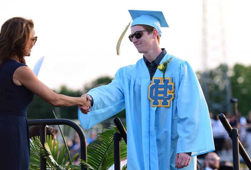 Cameron Draper is Cape High proud as he receives his diploma from board president Dr. Alison Myers.