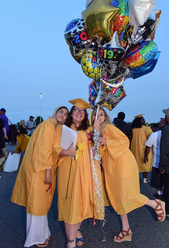 Caitlin Louia, center, celebrates her graduation and her birthday with friends Haneen Azem, left, and Kelsey Allen.