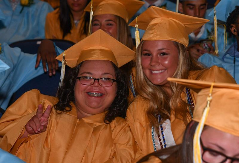 Awaiting the processional lineup are Victoria Rust, left, and Marcella Sabbagh.