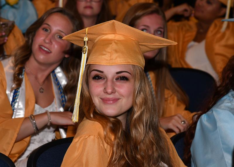 Haley Betyeman smiles for the camera as she awaits the processional lineup.