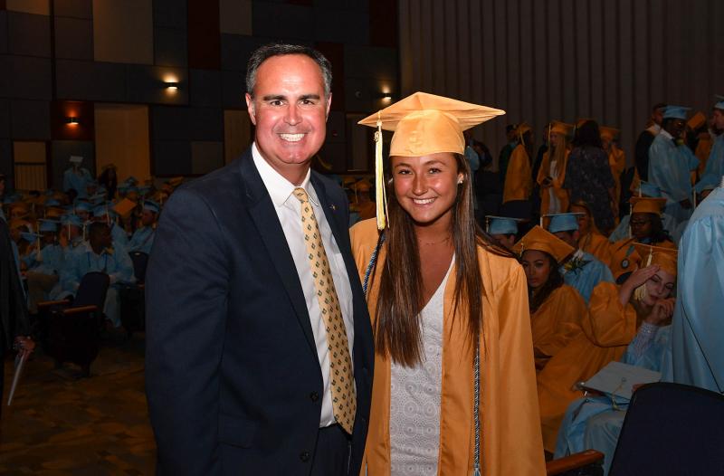 Commencement speaker Sen. Ernie Lopez meets with class of 2019 President Claire Rasin.
