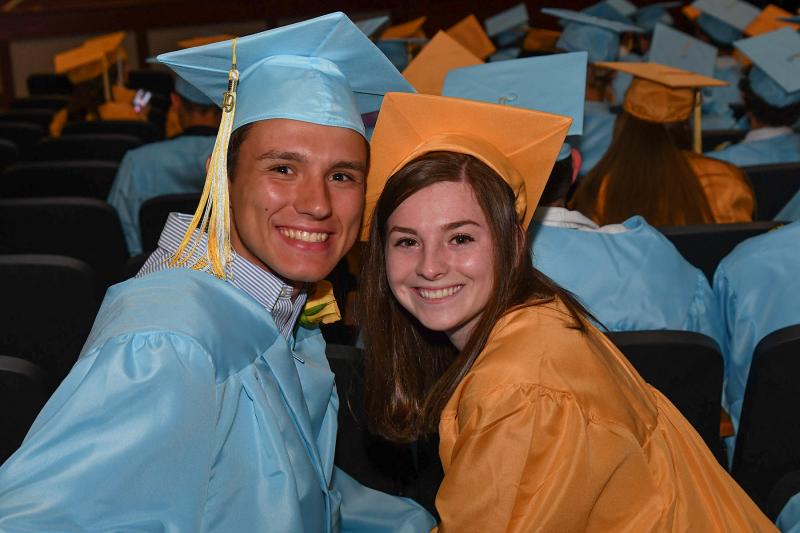 Friends Jacob Irwin and Vienna Iacona await the processional lineup.