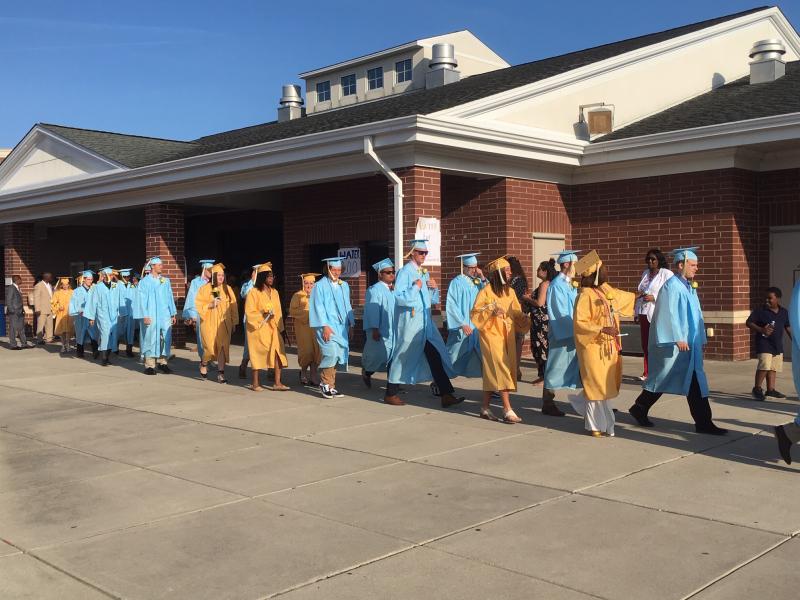 Cape High seniors proceed through the entrance to Legends Stadium June 4. DAN COOK PHOTOS