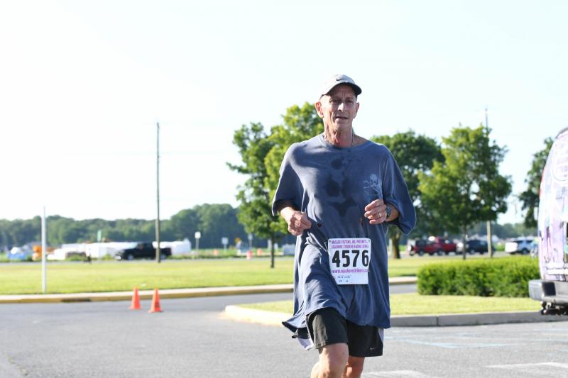 David Landis at the end of the Degnan 5K, his 2,000th consecutive day running.