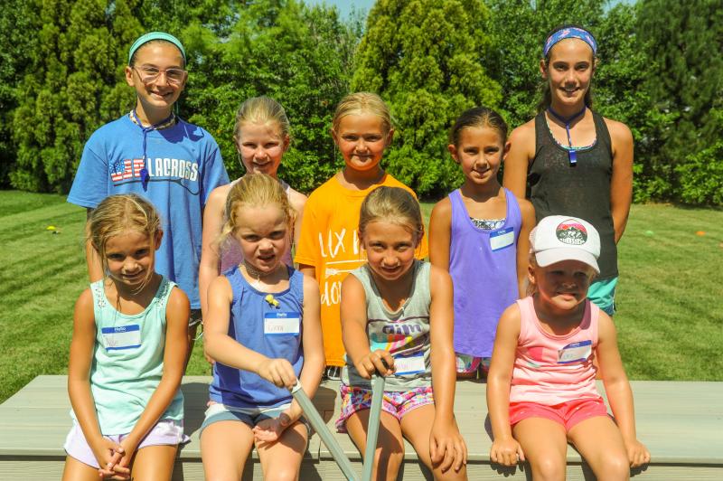 Five Dollar Lax Camp participants shown in back are (l-r) Quinn Nutter, Hannah Morstad, Minnie Townsend, Liza Williams and Shelby Manlove. In front are Allie Williams, Ginny Keys, Arilyn Staggs and Cora Hershelman. DAVE FREDERICK PHOTO