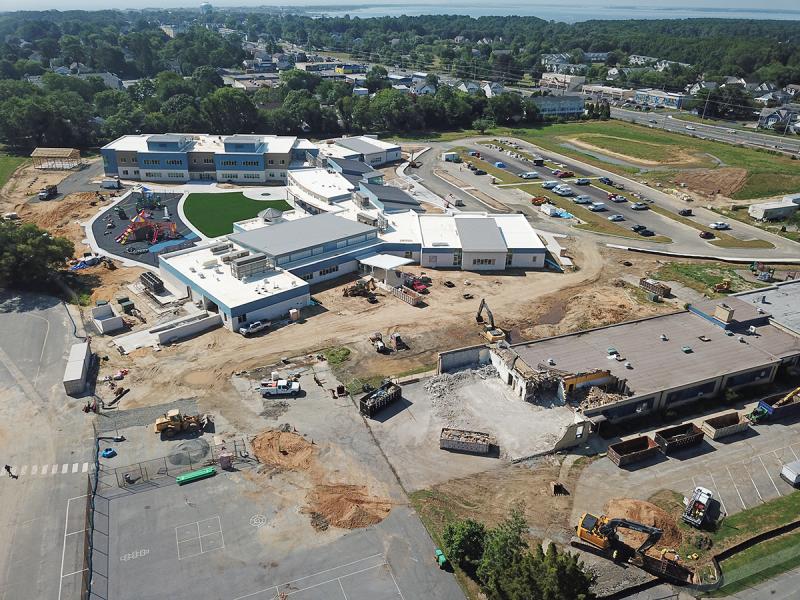 The little Rehoboth Elementary building, foreground, is being demolished to make room for a bus lane and multipurpose recreational area for the new school, seen in the background. NICK ROTH PHOTO