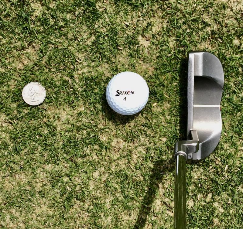 Putting your ball over the quarter from this distance is super easy, but doing the same thing from 3, 4, or 5 feet away is much more challenging - and also a good practice routine before playing a round. FRITZ SCHRANCK PHOTO