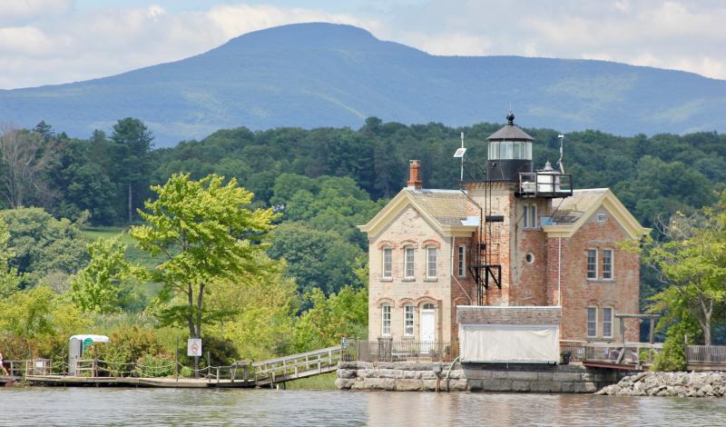 This lighthouse, with the Catskills in the background, stands at the south end of the Middle Ground Flats just below the village of Hudson on the Hudson.