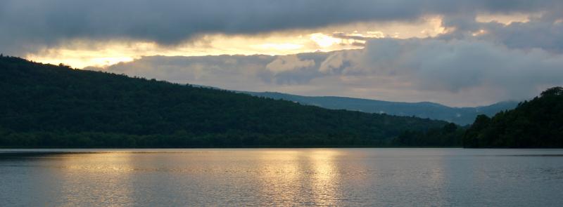 Here’s how the sunset started, with Mt. Defiance sloping downward from the left, Ticonderoga Point rising to the right, Lake Champlain reflecting the day’s last light in its mirror-like calm. Nature shows harmony. Even in its storms there is harmony, waiting patiently and quietly in the background, the natural state. Wars and lawsuits are disharmony. Inefficient, disruptive, wasteful. Ego-driven manifestations of humans’ inability to work together through problems to find solutions. Failures.