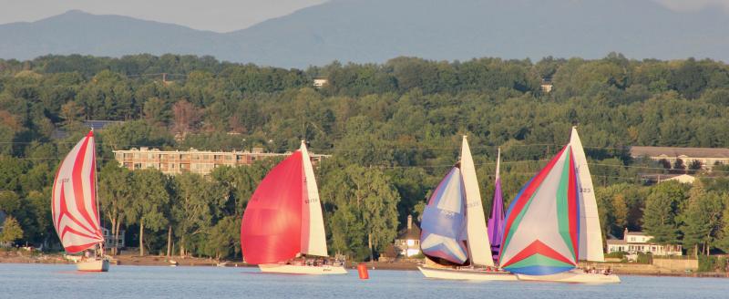 Crowding the downwind mark before the final upwind sprint to the finish.