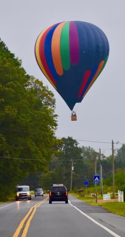 The Tailwinds Over Frederick team flies over Gravel Hill Road after taking off from Delaware Coastal Airport.