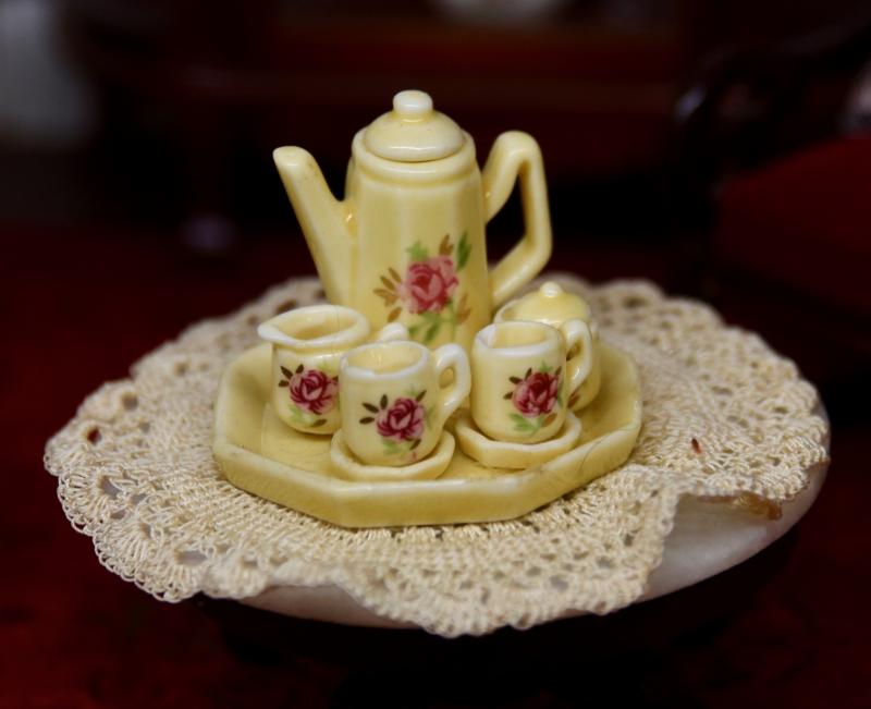 A miniature tea set is among the thousands of pieces included in the houses.