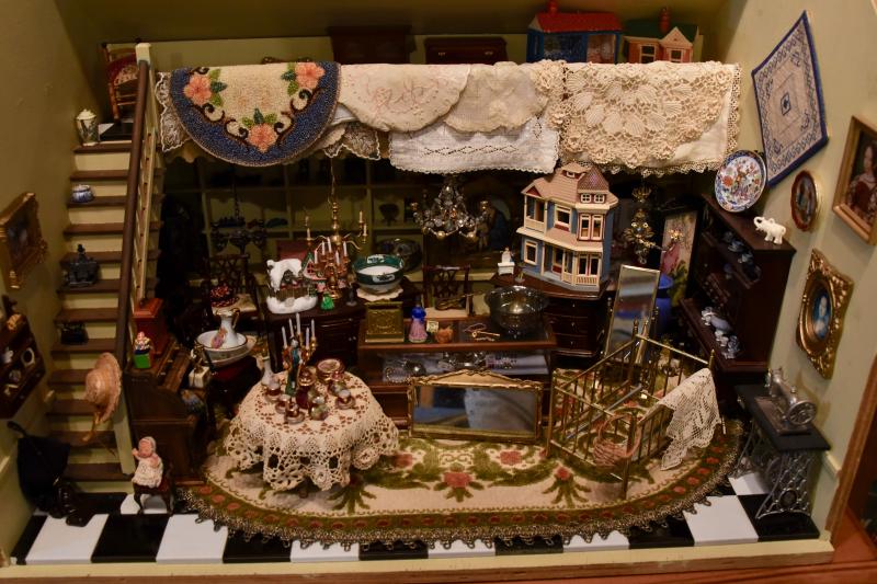 The friends used leftover miniatures to create an antiques shop.