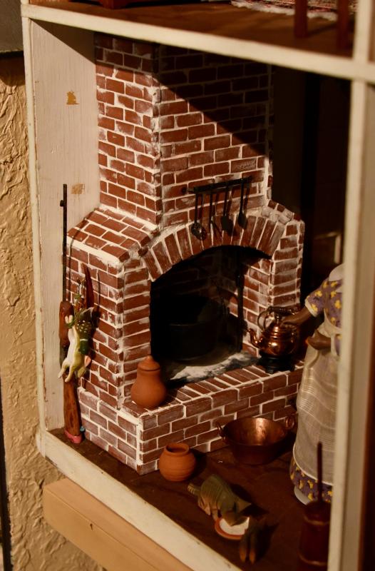 Cathy Tydings made this fireplace by hand, brick by brick.