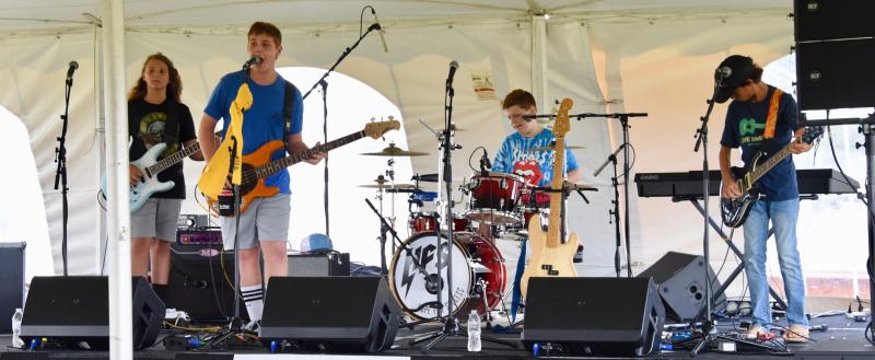 Hope for Success performs under the entertainment tent.