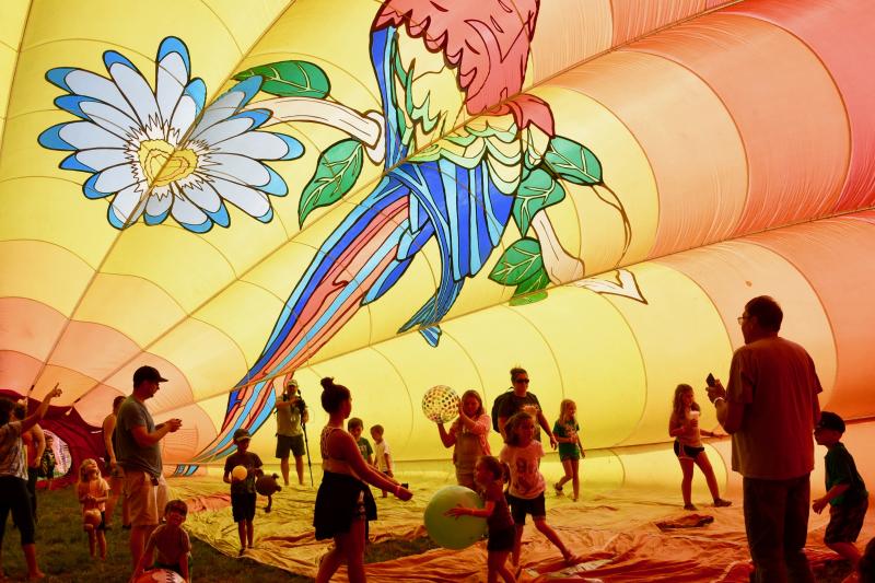 Balloons Over Sussex attendees enjoy the colors and space inside a hot air balloon.