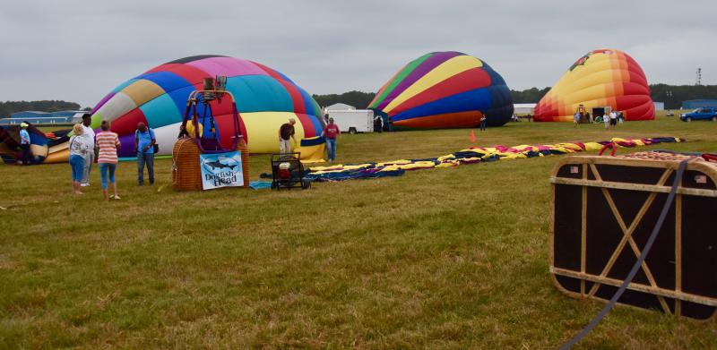 Teams use fans to move air into their balloons before they get upright.