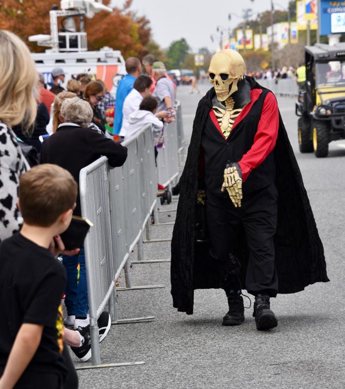 A terrifying ghoul walks along Rehoboth Avenue before the parade gets underway. RON MACARTHUR PHOTO