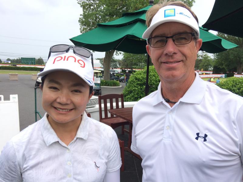 LPGA Tour veteran Ayako Uehara, left, and caddie Bob Kendall chatted about her new Ping golf clubs and the yardage gaps she maintains between them while at this year’s ShopRite LPGA Classic. FRITZ SCHRANCK PHOTO