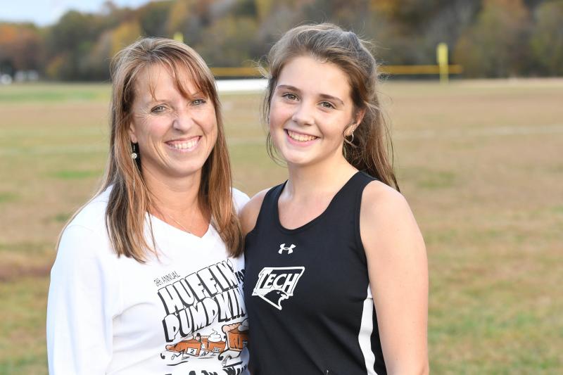 Jen Perry, a local runner, and her daughter Olivia Hudson after the Sussex County Cross Country Championships. Olivia pushed herself through the pain barrier and collapsed just yards from the finish line at the Henlopen Conference Championships Nov. 2. DAVE FREDERICK PHOTOS