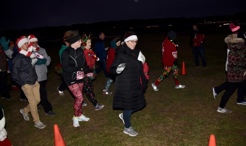 Dressed for the cold, walkers start out on a route around the grounds on opening night.