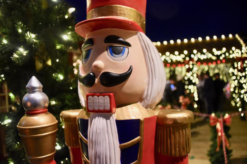 A large nutcracker stands guard at the entrance to the Schellville Village train station.