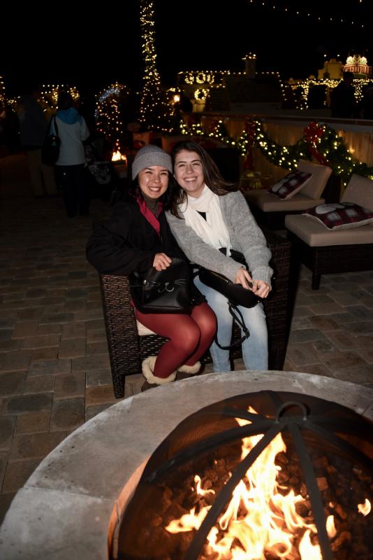 Aline Almedia, left, and Eduarda Paiva, visiting from Brazil, find a warm spot in Schellville.