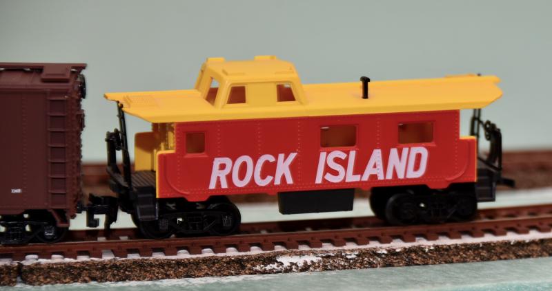 A Rock Island caboose brings up the rear of one of 10 trains included on the layout.