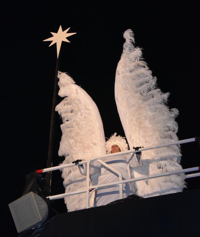 Each night an angel on high keeps a vigil over the living nativity on The Circle.