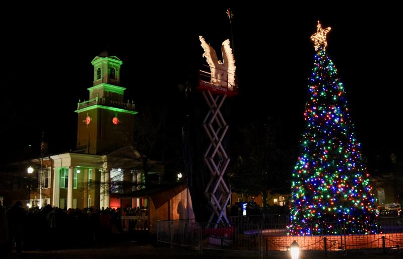 The Circle in Georgetown is aglow with lights of the season. In the middle is the living nativity’s angel.