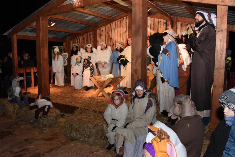 Characters in the Dec. 21 living nativity prepare for the arrival of the shepherds and wise men.