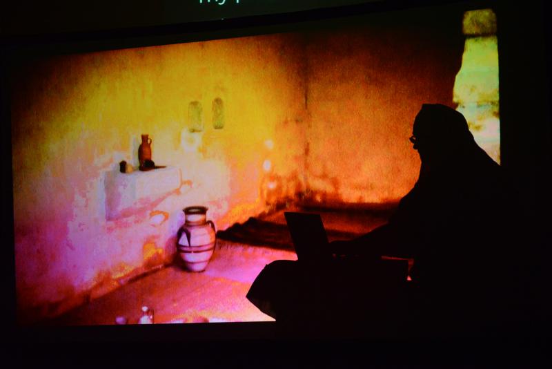 A shadow scene showing Paul writing his letters to Timothy. New Covenant Shadow