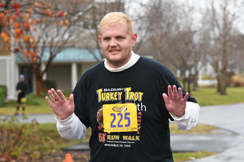 Jeremy Eglit is happy to be done a 5K in the rain. DAVE FREDERICK PHOTO