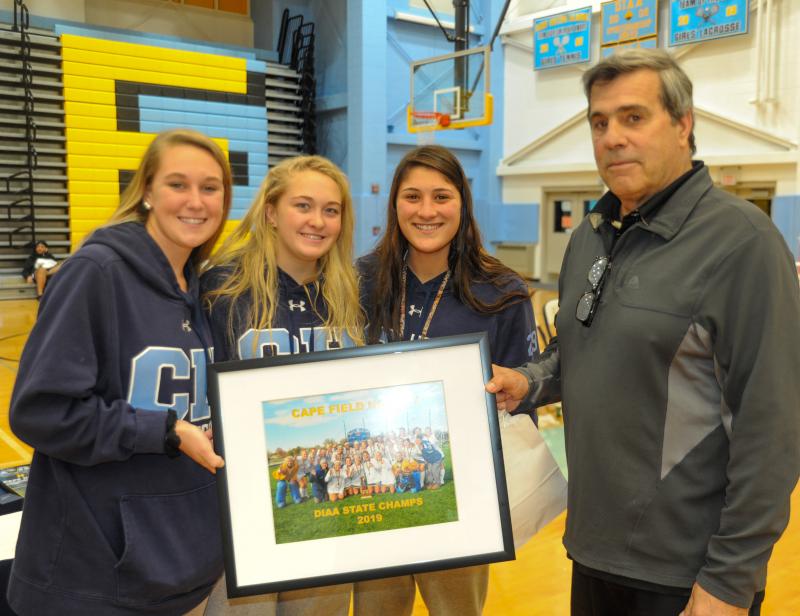 Lee Lee Wilson, Abby Kane and Anna Stancofski present Bob Cilento with a team photo.