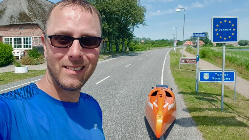 Just after retiring from the U.S. Air Force last summer, John Duffy set out on a 1,750-mile journey from Germany to Georgetown in his Velomobile. He’s shown here entering Højer, Denmark, the 500-mile mark. JOHN DUFFY PHOTOS
