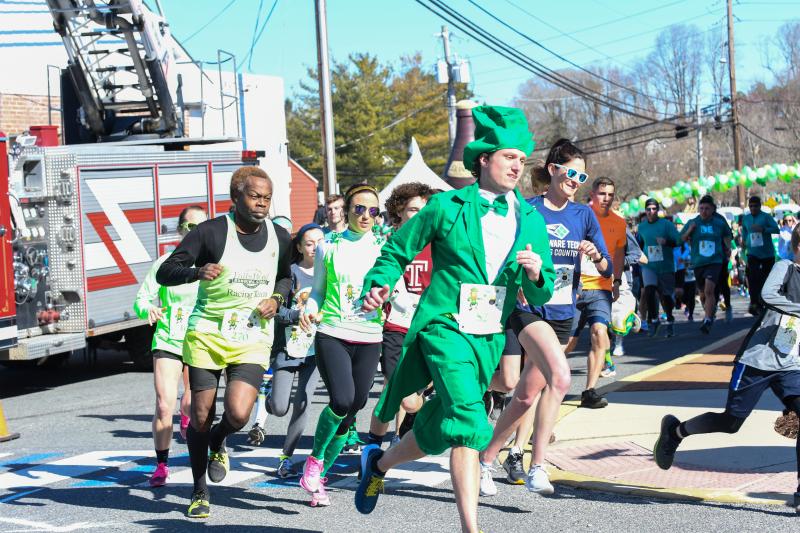 Andy Gorlich rounds the bend at the Lucky Leprechaun 5K in Milton. The race had 323 finishers.