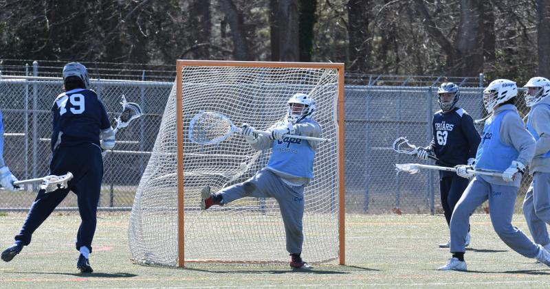 Baxter Travers defends the goal against the Friars of Malvern Prep.