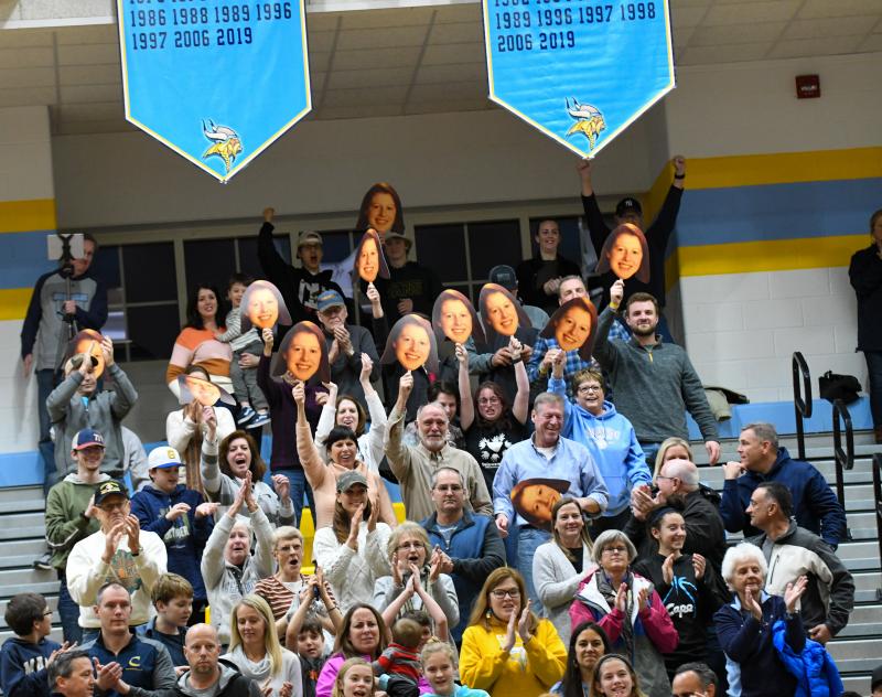 Abbey Hearn images pop up from the stands after she joins the 1,000-point club. DAVE FREDERICK PHOTOS