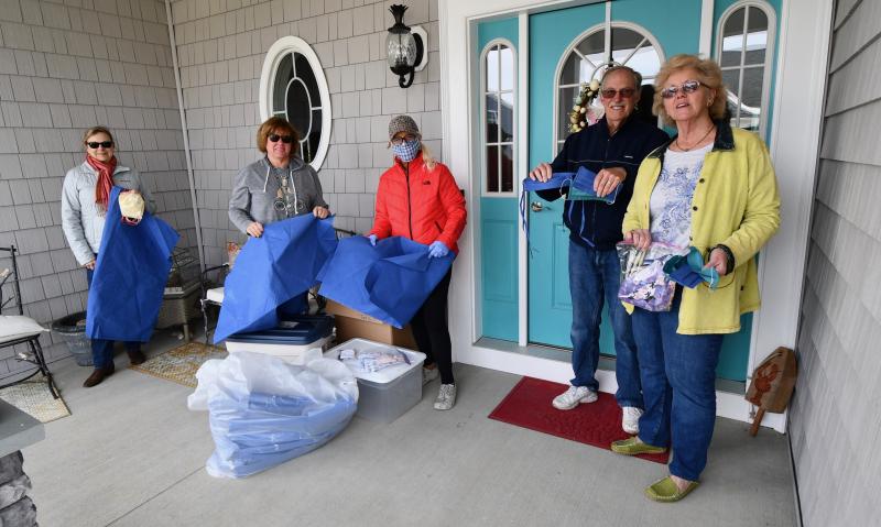 Displaying masks and materials are (l-r) volunteer Carla Andre, Kim Ostroski of Nanticoke Memorial Hosptial, volunteer Connie Zakszeski, and volunteers Dalton and Jan Semmel. It was Jan who got the idea for the sewing project nearly three weeks ago.