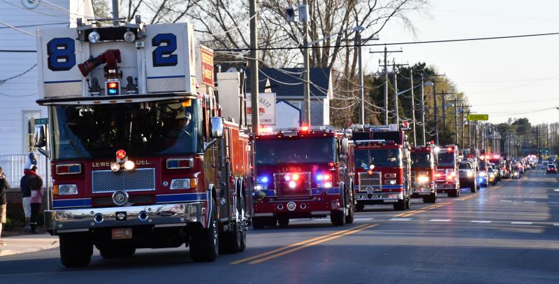 The Lewes Fire Department aerial truck leads a procession of nearly 50 fire trucks, ambulances and other vehicles as they head toward Beebe Healthcare. RON MACARTHUR PHOTO