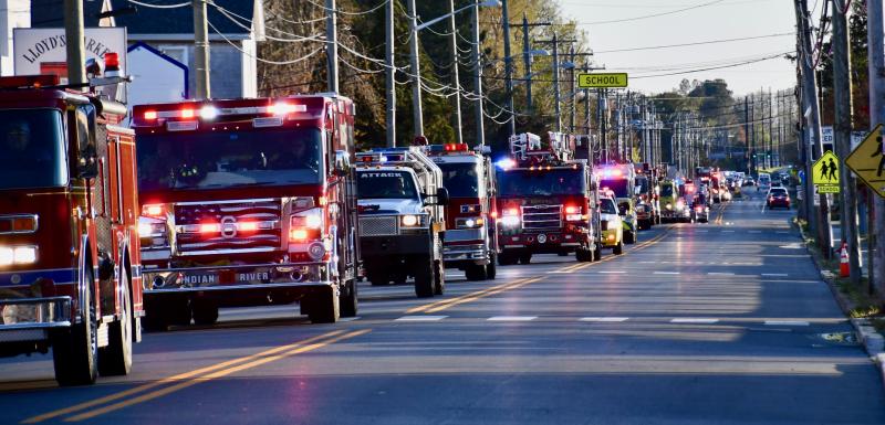 A long line of fire trucks and first responders from eastern Sussex County begin to surround Beebe Healthcare on Savannah Road in Lewes. In the April 9 event, firefighters paid tribute to Beebe workers. RON MACARTHUR PHOTO
