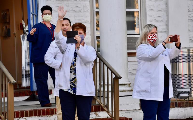 Beebe staff wave to the numerous volunteer firefighters as they park in front of the hospital. RON MACARTHUR PHOTO