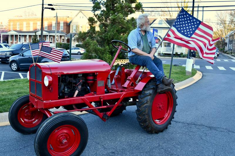Lewes blacksmith John Ellsworth joins in the tribute to Beebe on his antique tractor. RON MACARTHUR PHOTO