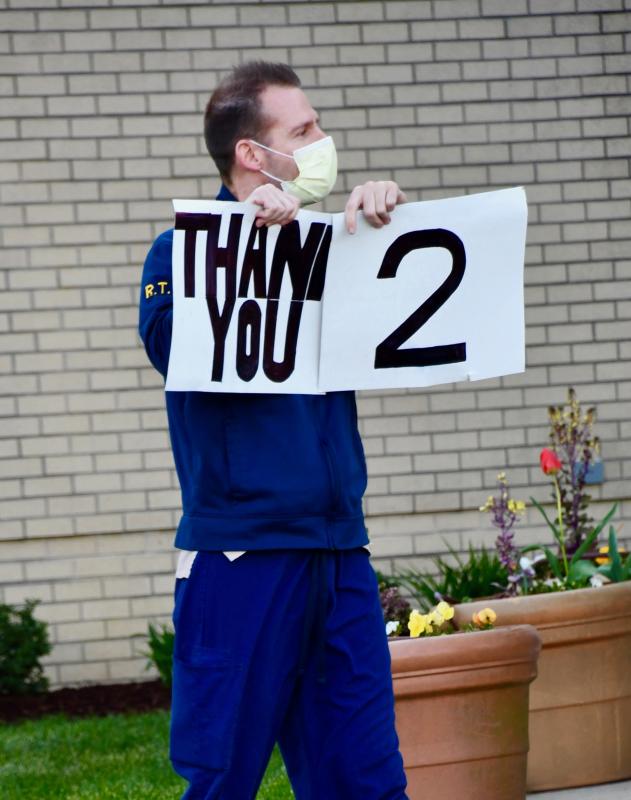 A Beebe employee returns the favor by displaying his own sign of thanks. RON MACARTHUR PHOTO